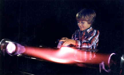 Playing with a magnet and a plasma discharge tube, the "Aurora Borealis Tube Display," by Resonance Research Corporation.