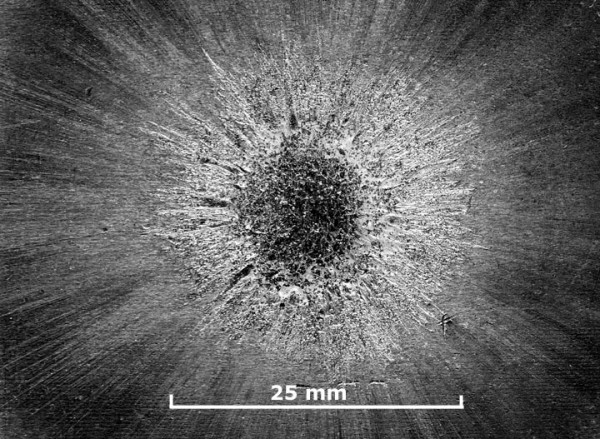 A 7 kilovolt 5 kilojoule impulsive blast on an aluminium block.